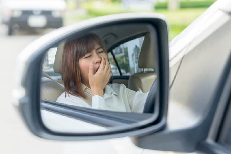 Woman driving tired