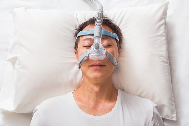 Lady sleeping with a cpap mask on